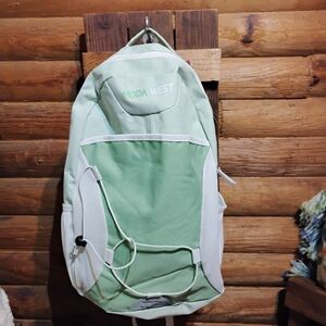 Modern Green and White Backpack with Adjustable Straps and Spacious Design